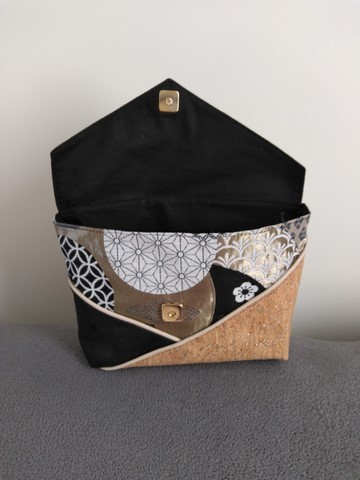 Pochette à poser cercles noirs, blancs et or