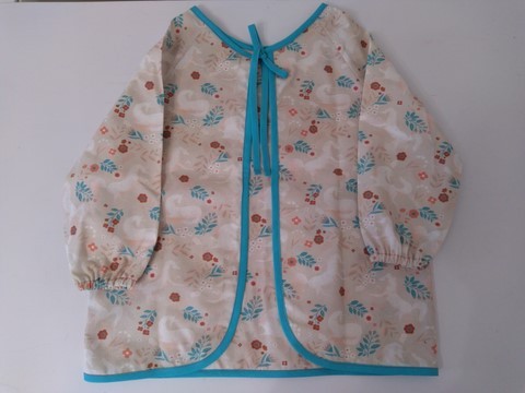 Bavoir tablier rose et turquoise, imprimé licornes